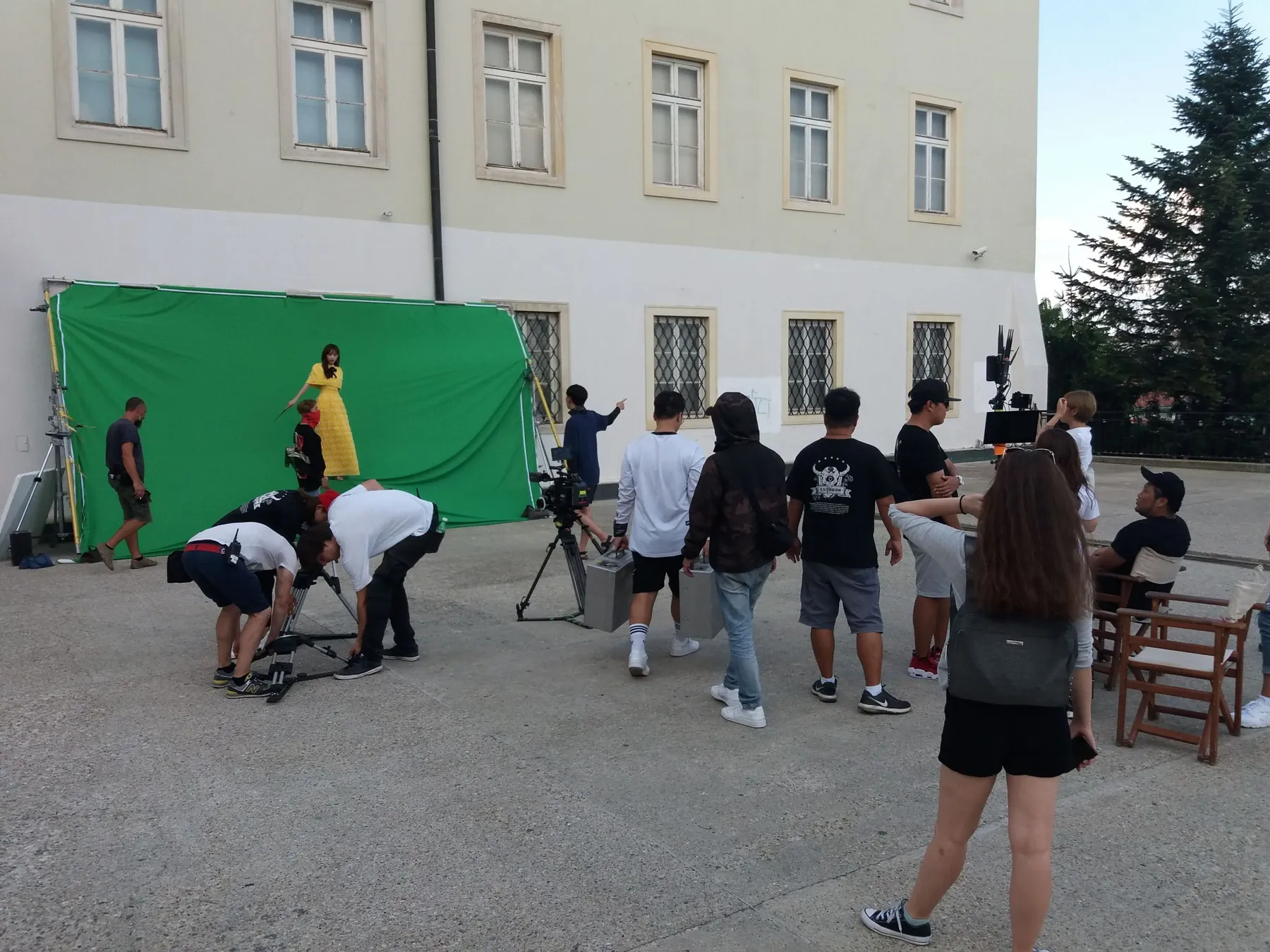 Exterior production with green screen and crew